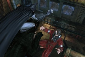 Batman: Arkham Asylum: The Caped Crusader about to drop a bad guy off a buidling.